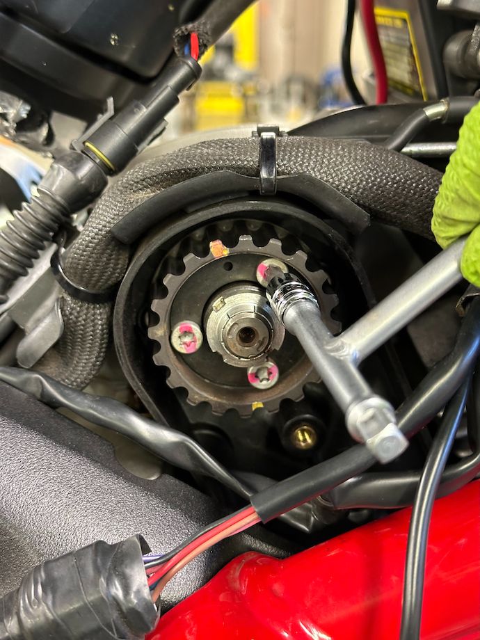 T-handle with torx bit engaged in rear cylinder timing pulley screw