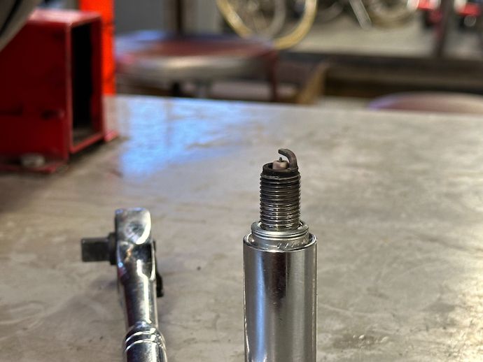 Spark plug and boot off of the front cylinder