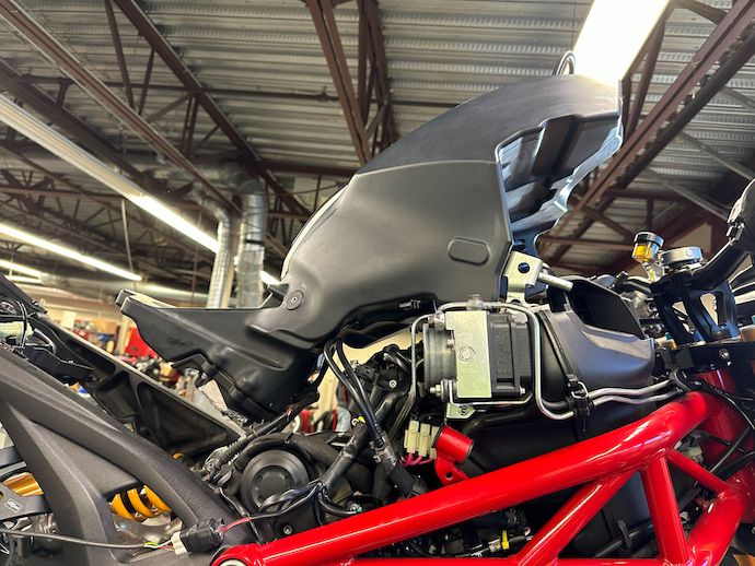 Fuel tank propped up on chassis